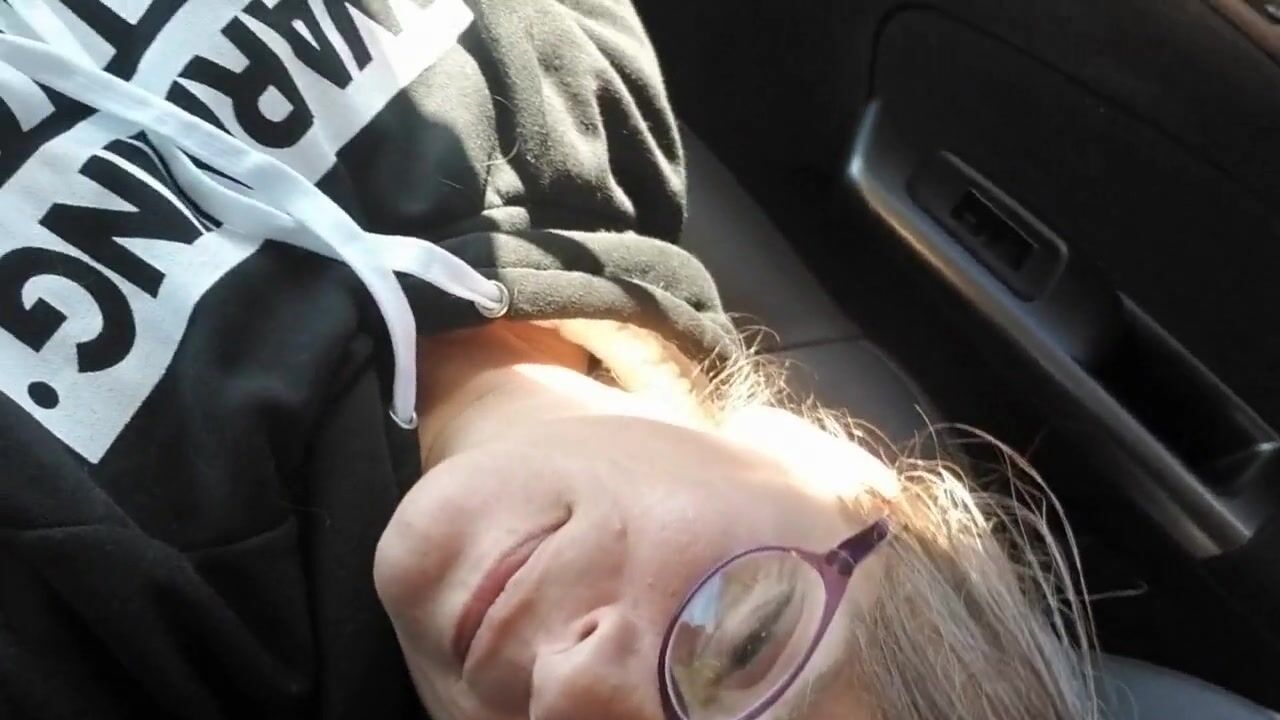 Masturbating in the Car While Her Husband Drives