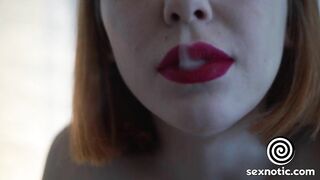 Redhead babe smokes and gives a blowjob to a big cock