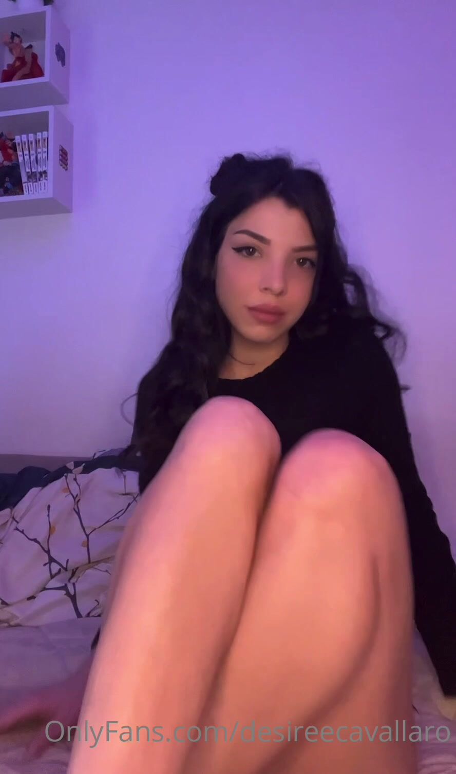 Desiree Cavallaro Stripteasing in Bed And Playing with Purple Dildo