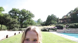 Caroline Zalog Trying On Clothes Outdoors